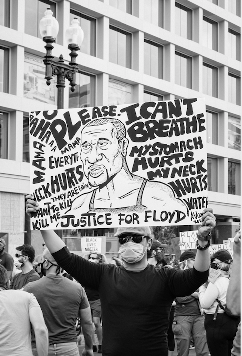juneteenth clockingyou man holding I can't breathe sign at protest gayatri-malhotra unsplash