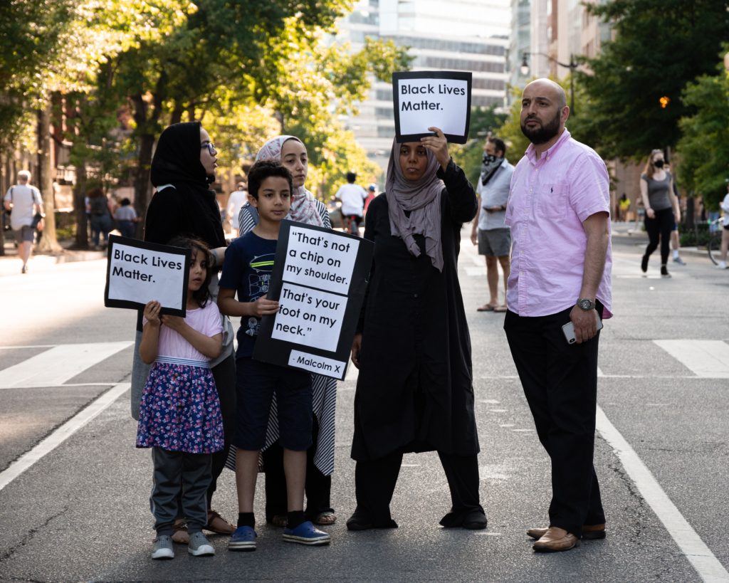 juneteenth clockingyou family at protest holding black lives matter sign koshu-kunii-unsplash