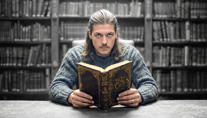 Driftgate alone in the library reading a book