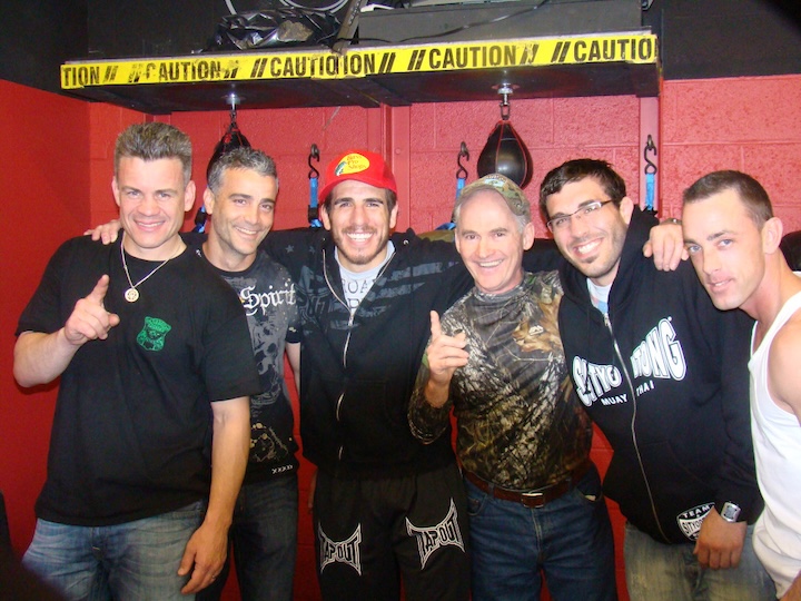 Peter Welch (Boxing) and Kenny Florian (MMA and BJJ) with training partners and coaches.